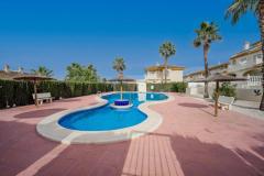 Semi detached with 3 bedrooms and 2 bathrooms in Benijofar (Benimar), Alicante.

This attractive semi-detached home offers a comfortable and versatile living space across three levels on a highly desirable corner plot. 

The property features three bedrooms and two bathrooms, including a spacious underbuild with a private entrance and an additional bedroom and bathroom, ideal for guests or extended family. Modern comforts include underfloor heating on both the ground and first floors, air conditioning, ceiling fans, and mosquito nets throughout. The main living areas are bright and spacious, with access to a private terrace overlooking the communal pool, while the top-level roof solarium provides stunning mountain views, perfect for relaxing or entertaining. The home also benefits from underground parking, off-road parking, and a large private outdoor area. 

Built in 1998, this well-maintained property is ideally suited for permanent residence, holidays, or investment, thanks to its prime location close to local amenities and its attractive outdoor spaces.

Bedrooms: 3
Bathrooms: 2
Build Size: 98 m2
Plot: 224 m2
Orientation: Southwest/Northeast
Year of construction: 1998

Air conditioning
Underfloor heating
Guttering all around
Ceiling fans
Communal pool
Corner-Plot
Garage
Off road parking
Underbuild (private entrance)
Large private roof solarium
Terrace overlooking the pool