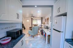 Semi detached with 3 bedrooms and 2 bathrooms in Benijofar (Benimar), Alicante.

This attractive semi-detached home offers a comfortable and versatile living space across three levels on a highly desirable corner plot. 

The property features three bedrooms and two bathrooms, including a spacious underbuild with a private entrance and an additional bedroom and bathroom, ideal for guests or extended family. Modern comforts include underfloor heating on both the ground and first floors, air conditioning, ceiling fans, and mosquito nets throughout. The main living areas are bright and spacious, with access to a private terrace overlooking the communal pool, while the top-level roof solarium provides stunning mountain views, perfect for relaxing or entertaining. The home also benefits from underground parking, off-road parking, and a large private outdoor area. 

Built in 1998, this well-maintained property is ideally suited for permanent residence, holidays, or investment, thanks to its prime location close to local amenities and its attractive outdoor spaces.

Bedrooms: 3
Bathrooms: 2
Build Size: 98 m2
Plot: 224 m2
Orientation: Southwest/Northeast
Year of construction: 1998

Air conditioning
Underfloor heating
Guttering all around
Ceiling fans
Communal pool
Corner-Plot
Garage
Off road parking
Underbuild (private entrance)
Large private roof solarium
Terrace overlooking the pool