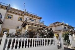 Townhouse with 2 bedrooms and 2 bathrooms in Orihuela Costa (Villas San Jose II), Alicante.

This charming townhouse offering a comfortable and stylish living space just a short distance from the vibrant heart of the area. Set on a generous 158 square meter plot, the property provides a perfect combination of privacy and outdoor enjoyment, ideal for those seeking a relaxed Mediterranean lifestyle.

Inside, the home features bright, well-proportioned rooms that create a seamless flow between indoor and outdoor living areas. The two bedrooms are spacious and inviting, complemented by two modern bathrooms designed for comfort and convenience. The living spaces are filled with natural light, enhancing the warm and welcoming atmosphere throughout the property.

Step outside to discover multiple outdoor areas, perfect for dining al fresco, entertaining guests, or simply basking in the Spanish sunshine. A notable highlight is the private solarium, an elevated space offering stunning views and ample room for sun loungers, outdoor seating, or even a summer kitchen—an ideal spot for enjoying warm evenings and sun-filled days.

Residents benefit from access to a well-maintained communal swimming pool, set within a peaceful, private street that enhances the sense of tranquility and exclusivity. The property also includes off-road parking, providing added convenience.

Located just a ten-minute walk from the lively Cabo Roig Strip, the property is close to an array of restaurants, bars, and entertainment options. The stunning beaches, local amenities, and excellent transport links are also nearby, making this an excellent choice whether as a permanent residence, holiday retreat, or investment opportunity.

Built in 2002, the property features air conditioning for comfort and offers a total build size of 85 square meters. Its northeast orientation ensures plenty of natural light, creating a bright and airy living environment in one of the most desirable areas on the Costa Blanca.

Bedrooms: 2
Bathrooms: 2
Build Size: 85 m2
Plot: 158 m2
Orientation: Northeast
Year of construction: 2002

Air conditioning
Communal pool
Private solarium
Terrace
Off road parking