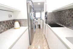 Townhouse with 3 bedrooms and 2 bathrooms in Algorfa (Lo Crispin), Alicante.

Discover this charming townhouse in the heart of Lo Crispin urbanization of Algorfa. Set within the secure Colinas De Vista Rosa community, residents enjoy access to two communal pools surrounded by lush gardens, creating a peaceful retreat.

Boasting three bedrooms and two bathrooms, this spacious home offers a perfect blend of comfort and style. The property has been upgraded by its current owners, featuring a bright and modern interior with generous indoor and outdoor living spaces. A welcoming front garden leads to a covered sun terrace, ideal for relaxing afternoons.

Inside, you'll find a large lounge-diner, a contemporary shower room, and a double bedroom on the ground floor, along with a well-appointed kitchen that opens to a glazed patio used as a games or storage room, with direct pool access.

Upstairs, two double bedrooms with built-in wardrobes and private terraces share a family bathroom with a walk-in shower. The rooftop solarium offers sunny outdoor space with lovely views over the gardens and pools, perfect for enjoying the warm Spanish climate. 

Located just a short stroll from local bars and restaurants, and close to the villages of Rojales, Benijofar and Formentera Del Segura. Built in 2005, the property is offered mostly unfurnished, with fitted wardrobes, a storage room, and a glazed patio.

Bedrooms: 3
Bathrooms: 2
Build Size: 82 m2
Orientation: East/West
Year of construction: 2005 

Mostly unfurnished
Fitted wardrobes
Storage room
Glazed patio
Solarium
Terrace
Communal pools