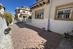 Townhouse with 2 bedrooms and 2 bathrooms in Orihuela Costa (Villas San Jose II), Alicante.

This charming townhouse offering a comfortable and stylish living space just a short distance from the vibrant heart of the area. Set on a generous 158 square meter plot, the property provides a perfect combination of privacy and outdoor enjoyment, ideal for those seeking a relaxed Mediterranean lifestyle.

Inside, the home features bright, well-proportioned rooms that create a seamless flow between indoor and outdoor living areas. The two bedrooms are spacious and inviting, complemented by two modern bathrooms designed for comfort and convenience. The living spaces are filled with natural light, enhancing the warm and welcoming atmosphere throughout the property.

Step outside to discover multiple outdoor areas, perfect for dining al fresco, entertaining guests, or simply basking in the Spanish sunshine. A notable highlight is the private solarium, an elevated space offering stunning views and ample room for sun loungers, outdoor seating, or even a summer kitchen—an ideal spot for enjoying warm evenings and sun-filled days.

Residents benefit from access to a well-maintained communal swimming pool, set within a peaceful, private street that enhances the sense of tranquility and exclusivity. The property also includes off-road parking, providing added convenience.

Located just a ten-minute walk from the lively Cabo Roig Strip, the property is close to an array of restaurants, bars, and entertainment options. The stunning beaches, local amenities, and excellent transport links are also nearby, making this an excellent choice whether as a permanent residence, holiday retreat, or investment opportunity.

Built in 2002, the property features air conditioning for comfort and offers a total build size of 85 square meters. Its northeast orientation ensures plenty of natural light, creating a bright and airy living environment in one of the most desirable areas on the Costa Blanca.

Bedrooms: 2
Bathrooms: 2
Build Size: 85 m2
Plot: 158 m2
Orientation: Northeast
Year of construction: 2002

Air conditioning
Communal pool
Private solarium
Terrace
Off road parking