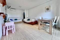 Top floor apartment with 2 bedrooms and 1 bathroom in Pilar de la Horadada (Mil Palmeras), Alicante.

This stunning apartment is situated just a few meters from the beach, it is surrounded by beautifully maintained green and landscaped areas, offering a peaceful and inviting environment.

The property boasts a spacious terrace on the main level, perfect for enjoying the Mediterranean climate with direct views of the communal pool. Inside, it features two bedrooms and a bathroom, along with a bright and airy living-dining room that opens directly onto the terrace, creating a sense of space and comfort. The fully equipped French-style kitchen is complemented by a practical separate laundry area.

Upstairs, there is a spectacular private solarium of 58 m2, ideal for sunbathing, relaxing, or setting up a chill-out zone, with views overlooking the pool area. The urbanization provides a tranquil setting with expansive landscaped communal gardens, making it suitable for both holidays and permanent residence.

Additional features include air conditioning, furniture, a garage space included in the price, a storage room, and the property is sold furnished. Constructed in 2003, the property has a total built area of 120 m2 and faces northeast.

This is a unique opportunity to enjoy coastal living in one of the most desirable areas of Mil Palmeras, with all the amenities and comforts to make everyday life enjoyable.

Bedrooms: 2
Bathroom: 1
Build Size: 120 m2
Orientation: Northeast
Year of construction: 2003

Air conditioning
Community pool
Fully furnished
Solarium
Garage (included in price)
Terrace
Wardrobes cupboard
Washing room
Storeroom